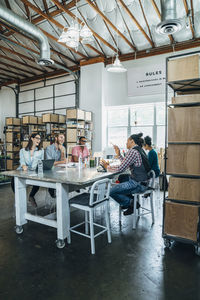 Business people having discussion at conference table in office