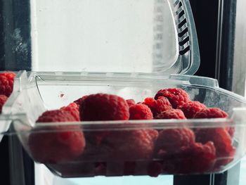 Close-up of strawberries in glass container