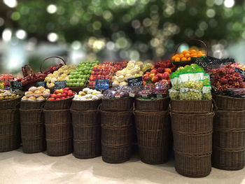Various fruits in wicker baskets for sale at market