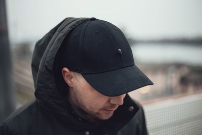 Close-up of man wearing cap 