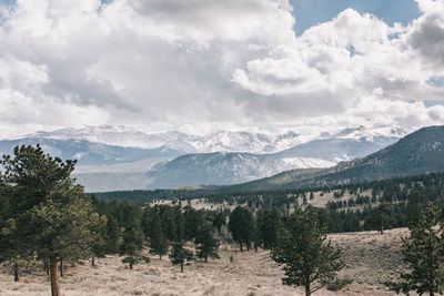 Scenic view of landscape and mountains against sky