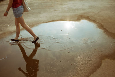 Close-up of woman standing in pond