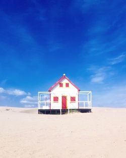 View of beach against blue sky