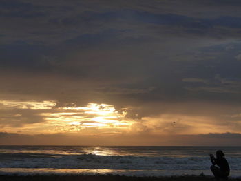 Scenic view of sea at sunset