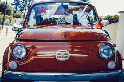 Close-up of vintage car on street