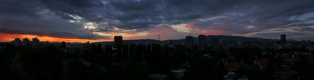 Clouds over city at sunset