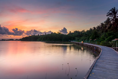 Scenic view of lake against sky during sunset