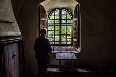 Woman standing in window