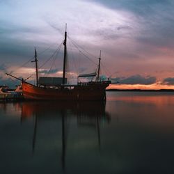 Boats moored at harbor