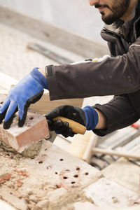 Bricklayer working on construction site