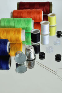 Close-up of colorful spools arranged on table