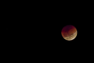 Low angle view of moon against sky at night