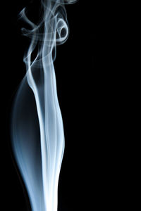 Close-up of smoke against black background