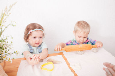 Boy and girl playing at home