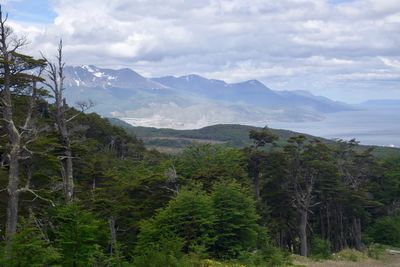 Scenic view of mountains against cloudy sky