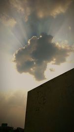 Low angle view of building against sky during sunset