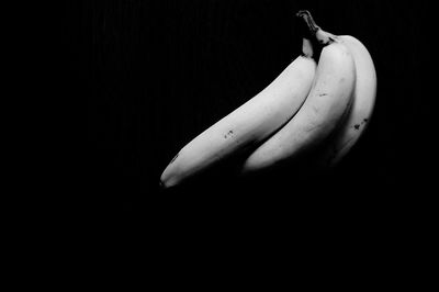 Close-up of fruit over black background