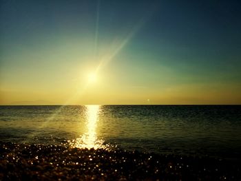 Scenic view of sea against sky at sunset