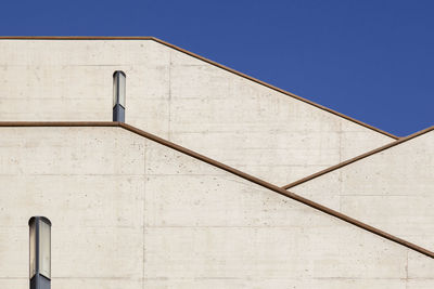 Low angle view of building against clear blue sky