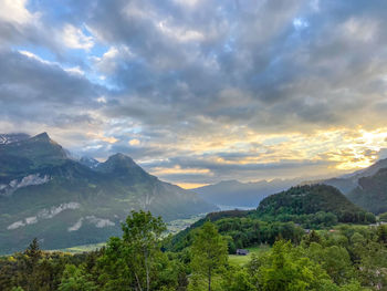 Scenic view of mountains against sky during sunset