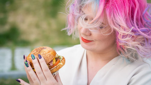 Portrait of woman holding ice cream