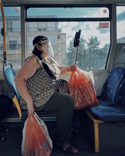 Woman sitting in bus