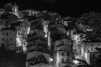 High angle view of illuminated buildings in city at night