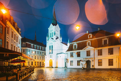 View of buildings in city at night