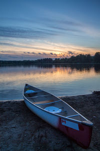 Scenic view of calm lake at sunset