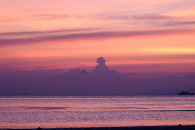 Scenic view of sea against orange sky