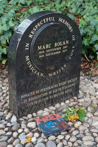 High angle view of text on stone at cemetery