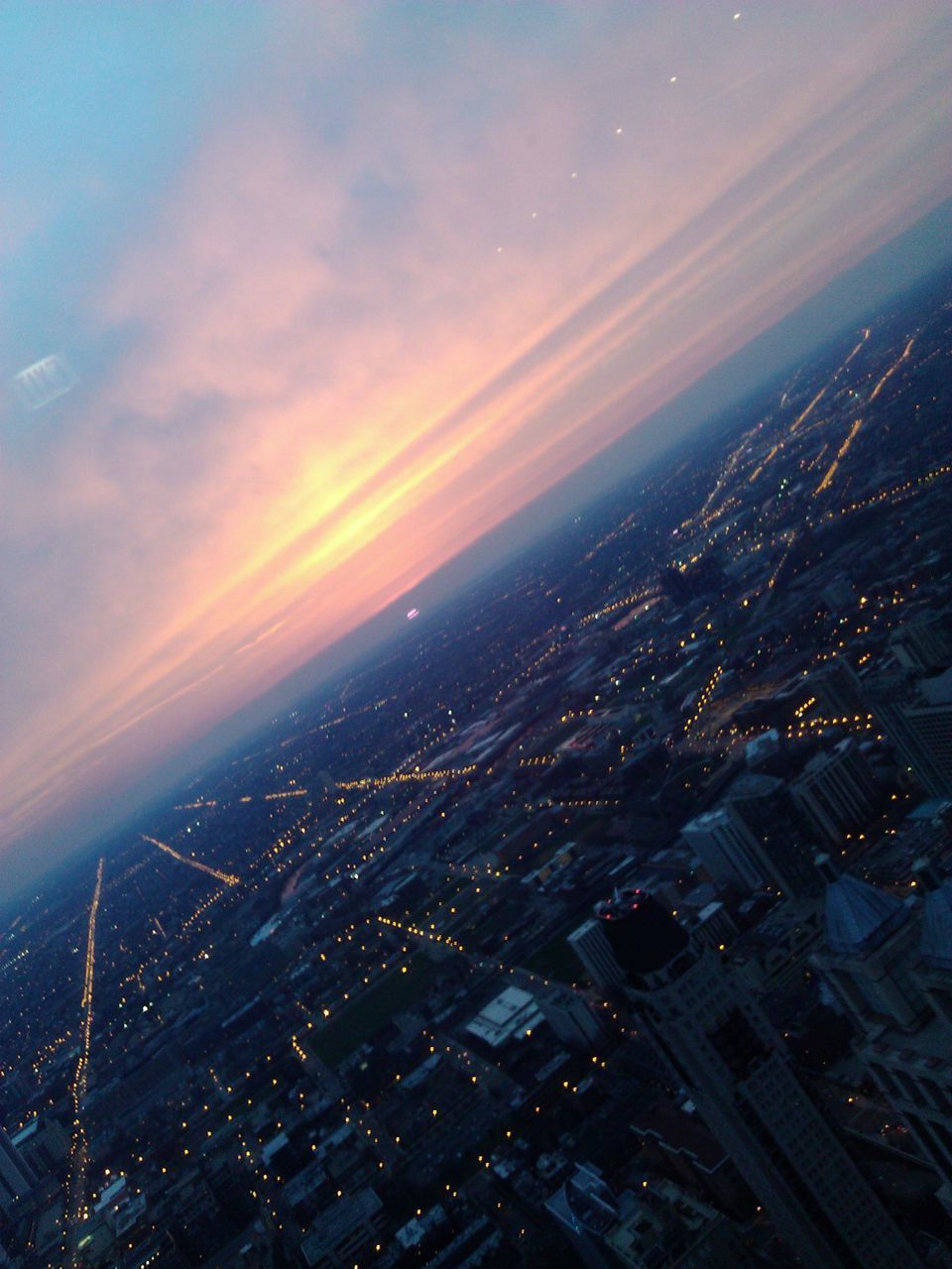 sunset, cityscape, city, sky, aerial view, building exterior, architecture, built structure, high angle view, scenics, crowded, cloud - sky, orange color, beauty in nature, residential district, landscape, sea, nature, horizon over water, outdoors