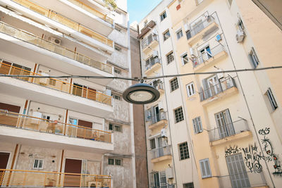 Low angle view of buildings in city against sky