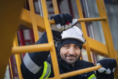 Engineer at building site looking at camera