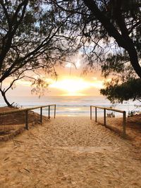 Scenic view of beach and sea against sky during sunset