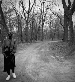 Man on bare tree