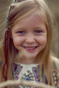 Girl indian shaman blonde in a poncho and a dream catcher