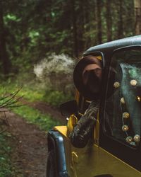 Close-up of man in car