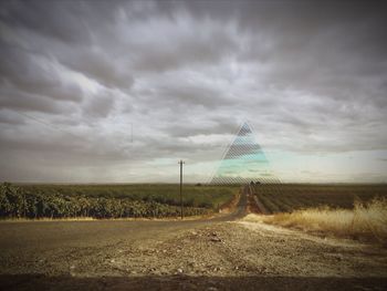 Scenic view of landscape against cloudy sky