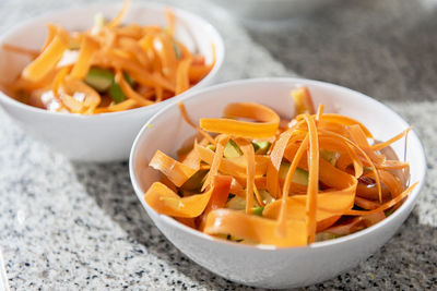 Close up of bowls with salad.