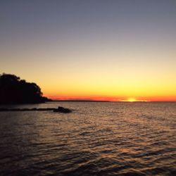 Scenic view of sea at sunset