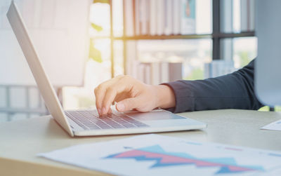 Man using laptop on table