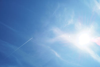 Low angle view of vapor trails in sky