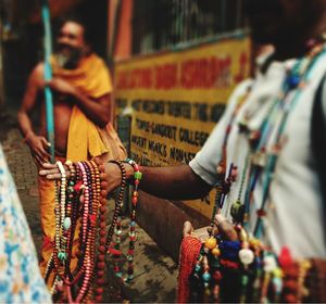 Man selling bead necklaces