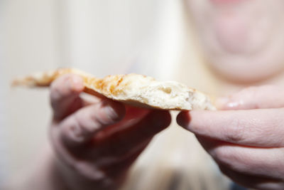 Close-up of hand holding ice cream