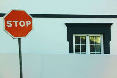 Close-up of road sign against clear sky