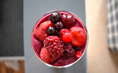 Directly above shot of strawberries in glass on table