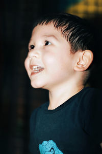 Smiling boy looking away