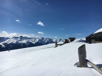 Scenic view of snow covered mountains against sky