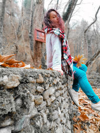 Full length of girl standing on rock